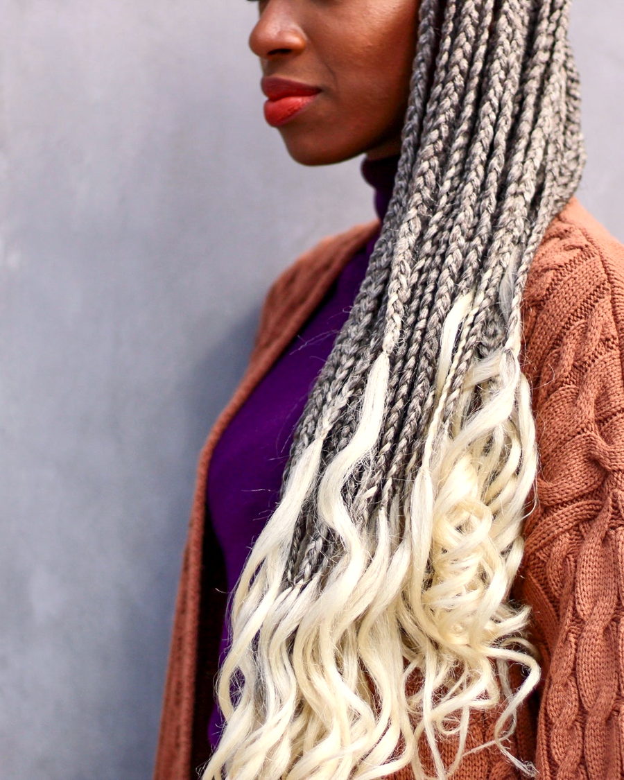 A profile view of long braids falling past the shoulder